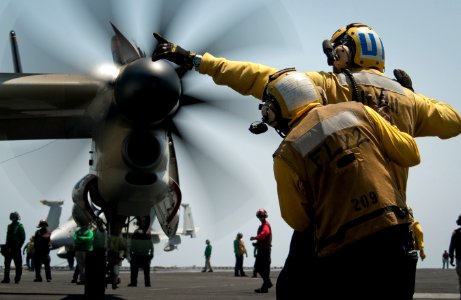 US Navy 110426-N-8040H-050 Aviation boatswain's mates (handling) direct an E-2C Hawkeye aboard the Nimitz-class aircraft carrier USS Carl Vinson (C
