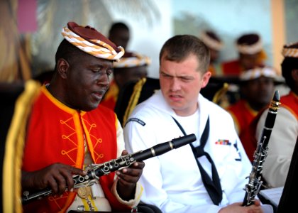 US Navy 110421-N-NY820-053 U.S. Fleet Forces Band member Musician 3rd Class Fred Vaughan talks with a Jamaican Defense Force Band member during the photo