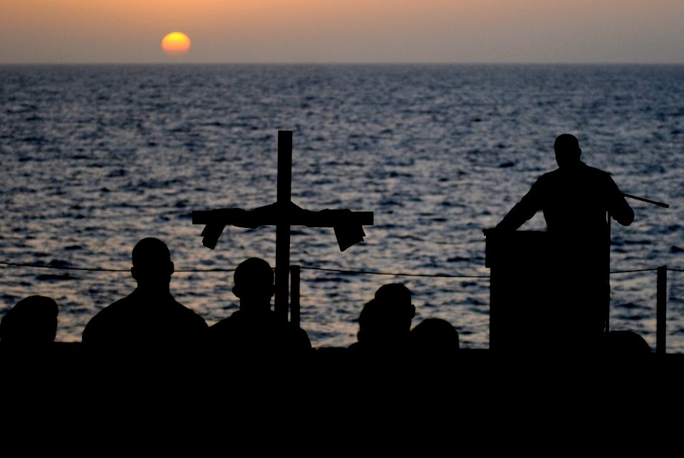 US Navy 110424-N-6320L-207 Sailors aboard the Nimitz-class aircraft carrier USS Carl Vinson (CVN 70) participate in an Easter Sunday sunrise servic
