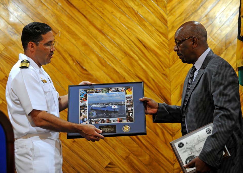 US Navy 110421-N-NY820-163 KINGSTON, Jamaica (April 21, 2011) Commodore Brian Nickerson, mission commander of Continuing Promise 2011, exchanges g