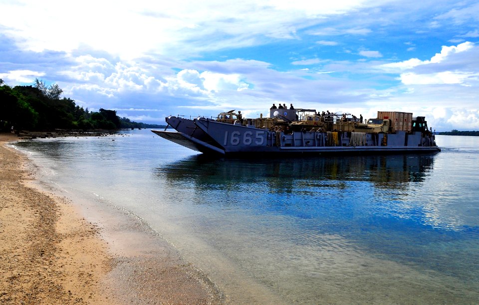US Navy 110428-N-KB563-070 Landing Craft Utility (LCU) 1665 approaches the beach in Espiritu Santo during Pacific Partnership 2011