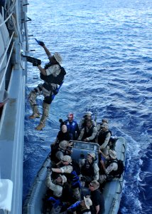 US Navy 110424-N-NL541-465 The visit, board, search and seizure team assigned to the guided-missile destroyer USS Nitze (DDG 94) boards the guided photo