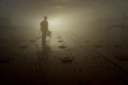 US Navy 110421-N-ZC343-034 A shipyard worker pressure washes the well deck of the amphibious assault ship USS Bonhomme Richard (LHD 6) in preparati
