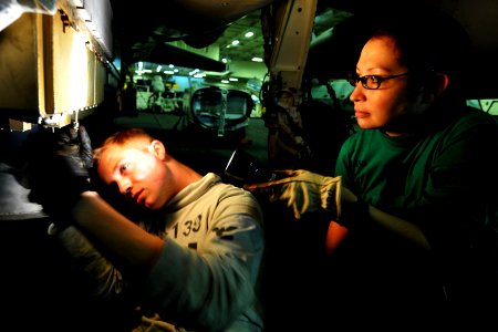 US Navy 110422-N-1004S-059 Sailors tighten fasteners on the ALQ-99 Pod of an EA-6B Prowler in the hangar bay of the aircraft carrier USS Ronald Rea