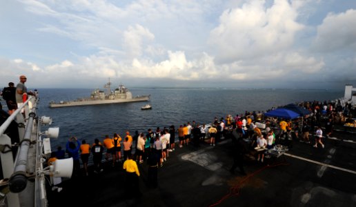 US Navy 110425-N-NY820-241 Personnel embarked aboard the Military Sealift Command hospital ship USNS Comfort (T-AH 20) participate in a steel beach photo