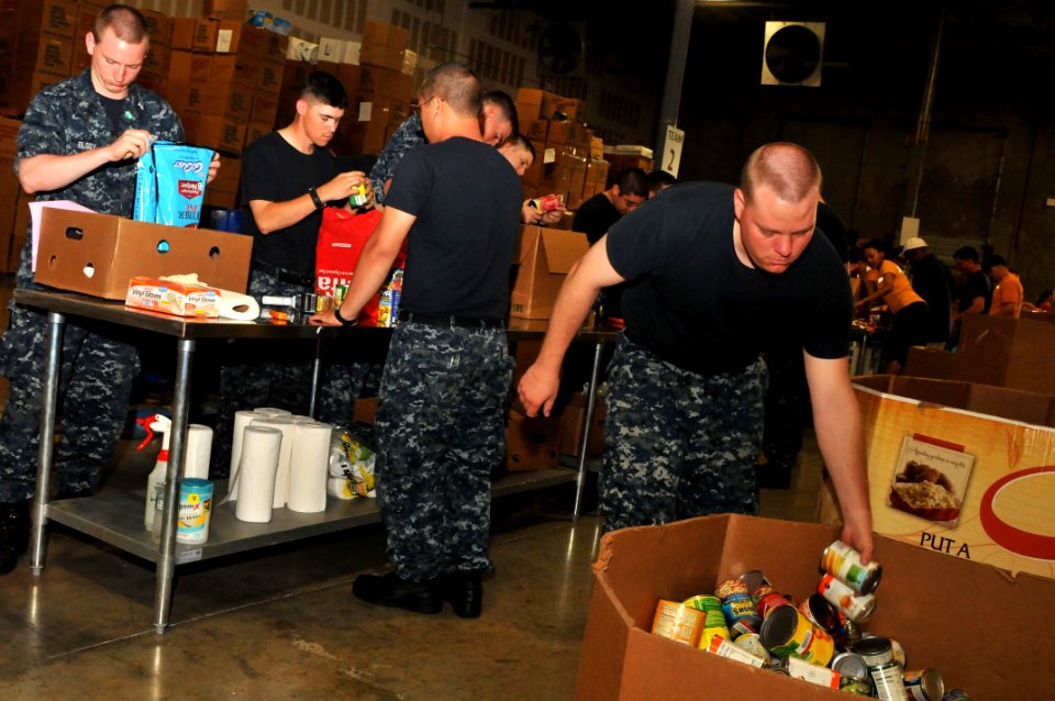 US Navy 110429-N-6651N-210 Sonar Technician Seaman Daniel Rotzell places cans into a receptacle at the Feeding South Florida Warehouse during a Fle