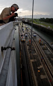US Navy 110426-F-ET173-035 Capt. Randall Rockwood radio information to the bridge as Comfort transits the Panama Canal while deployed in support of
