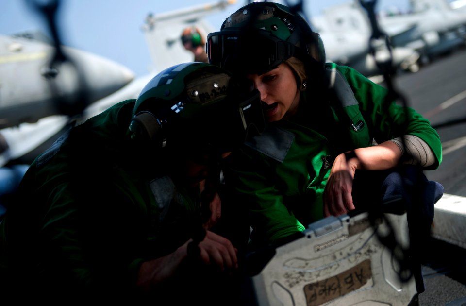 US Navy 110429-N-2055M-042 Aviation Electrician's Mate 2nd Class Amanda Mondino ives instructions to Aviation Electrician's Mate Airman Christopher