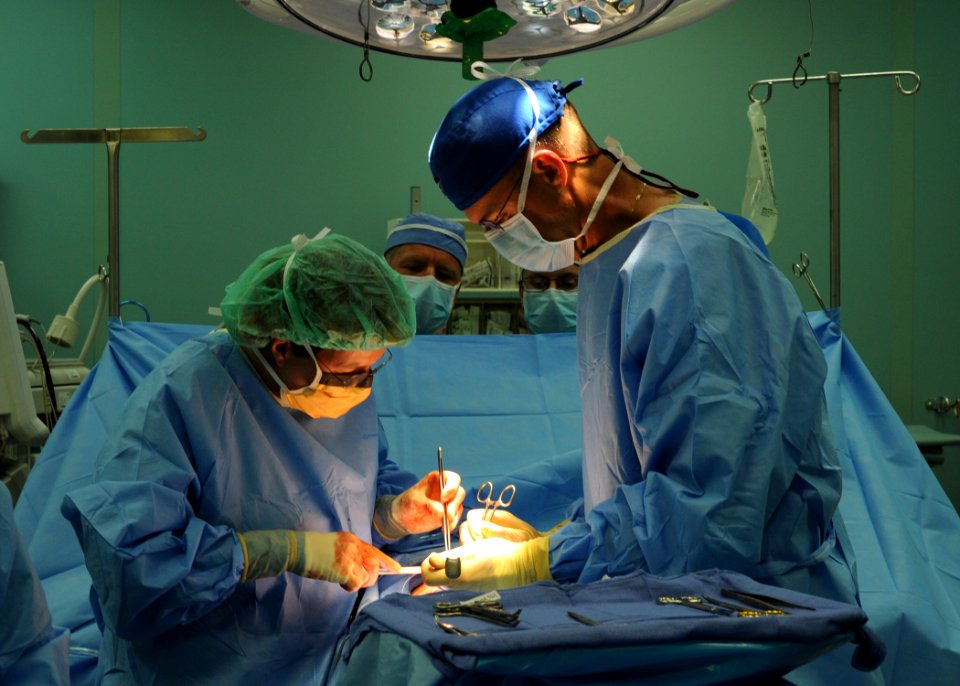 US Navy 110427-N-NY820-294 Capt. Beth Jaklic, left, and Cmdr. Eric Gessler perform an open appendectomy on Electrician's Mate 3rd Class Mikhail Gri