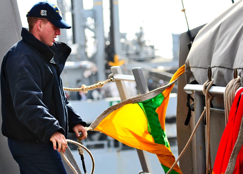 US Navy 110428-N-XO436-059 Quartermaster Seaman Clayton Judd hoists the preparation flag aboard the guided-missile destroyer USS Barry (DDG 52) dur