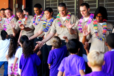US Navy 110426-N-WP746-257 Students at Pearl City Elementary School give Sailors assigned to Commander, Navy Region Hawaii high-fives for the volun