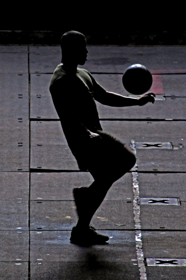US Navy 110425-N-RC734-114 A U.S. Marine assigned to the 13th Marine Expeditionary Unit (13th MEU) practices soccer drills in the well deck of the