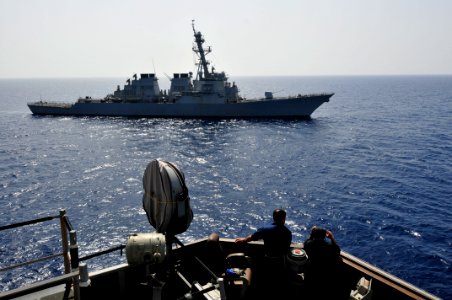 US Navy 110503-N-XO436-464 Sailors observe the guided-missile destroyer USS Stout (DDG 55) from the bridge wing aboard the guided-missile destroyer