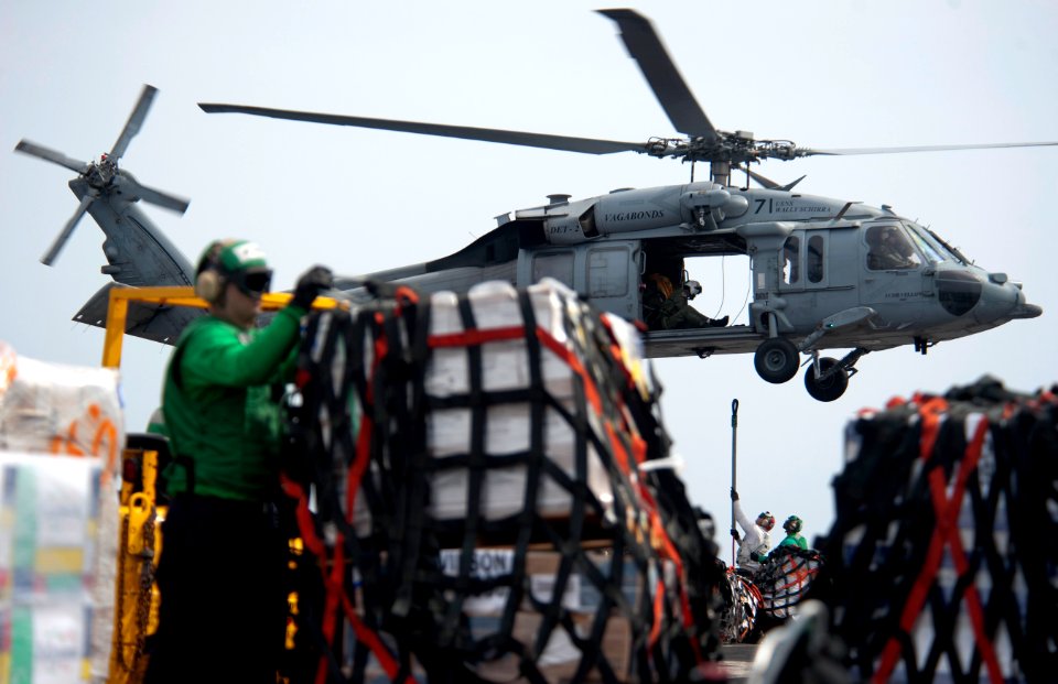 US Navy 110428-N-DR144-487 Sailors assigned to the supply department of the Nimitz-class aircraft carrier USS Carl Vinson (CVN 70) attach stores to