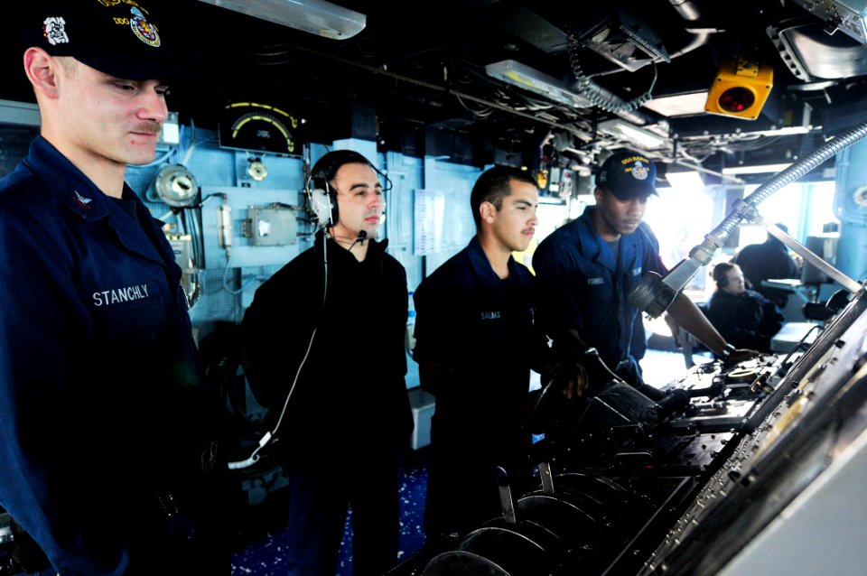 US Navy 110503-N-XO436-316 Sailors steer the ship during a replenishment at sea