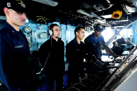 US Navy 110503-N-XO436-316 Sailors steer the ship during a replenishment at sea