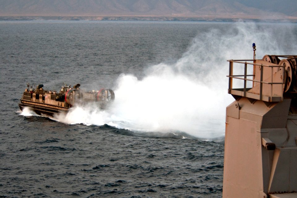 US Navy 110427-N-RC734-216 A landing craft air cushion (LCAC) assigned to Assault Craft Unit (ACU) 5 departs the amphibious dock landing ship USS C