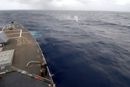 US Navy 110503-N-ZI300-089 A Sailor aboard the guided-missile destroyer USS Nitze (DDG 94) fires a .50-caliber machine gun at a target during the A