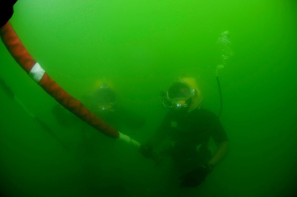 US Navy 110426-N-OT964-329 Navy Diver 1st Class Dean Bates, right, and Navy Diver 2nd Class Troy Crowder conduct a surface-supplied training dive