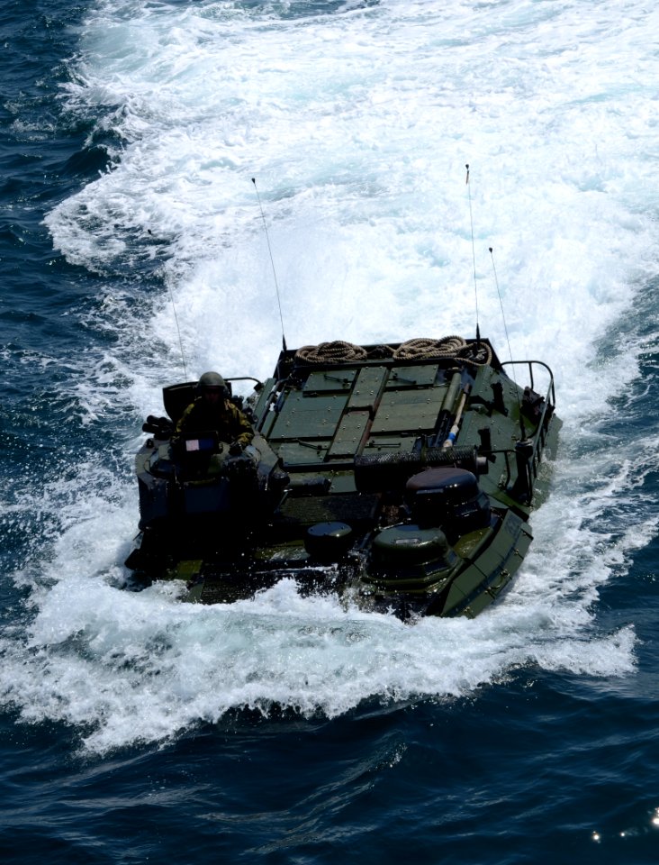 US Navy 110504-N-7680E-147 An amphibious assault vehicle approaches the well deck of USS Iwo Jima (LHD 7)