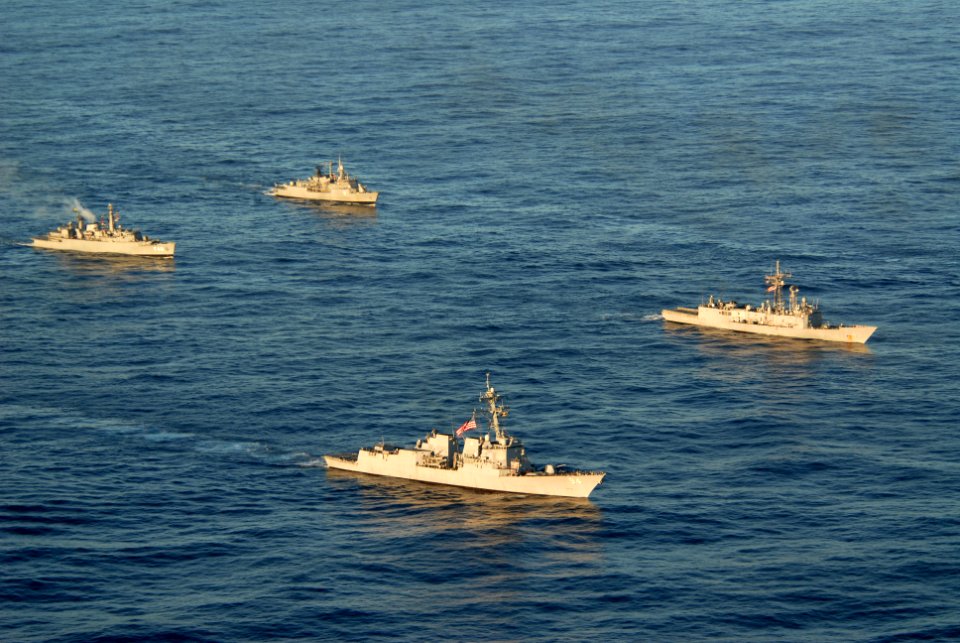 US Navy 110504-N-ZI300-304 The guided-missile destroyer USS Nitze (DDG 94), bottom center, and the guided-missile frigate USS Thach (FFG 43),