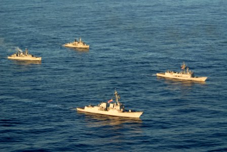 US Navy 110504-N-ZI300-304 The guided-missile destroyer USS Nitze (DDG 94), bottom center, and the guided-missile frigate USS Thach (FFG 43),