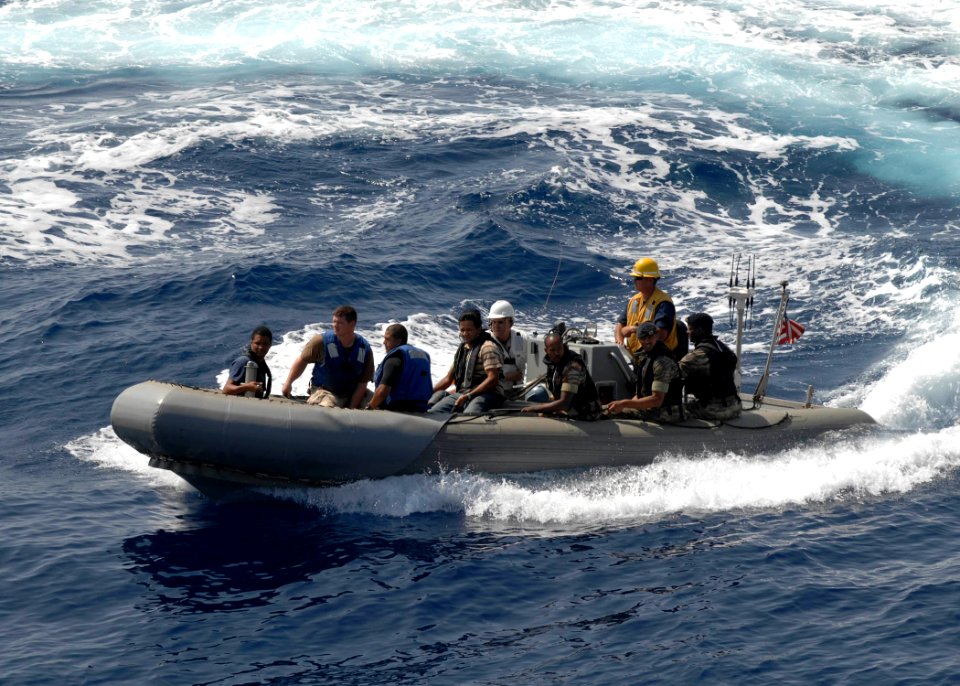 US Navy 110427-N-HI707-999 A visit, board, search and seizure team from Cape Verdean circles the guided-missile frigate USS Robert G. Bradley (FFG