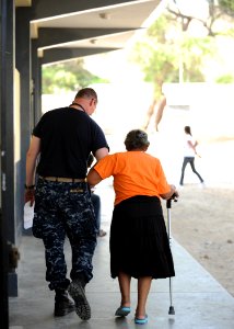 US Navy 110503-N-NY820-189 Lt. Cmdr. Rolf Muldbakken walks a patient to an examination room during Continuing Promise 2011 photo