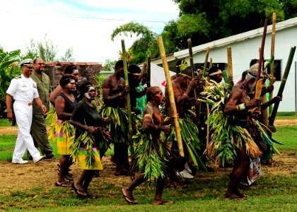 US Navy 110429-F-HS649-053 apt. Jesse A. Wilson, mission commander of Pacific Partnership 2011, is escorted into the Nakamal Chief Lodge by ni-Vanu
