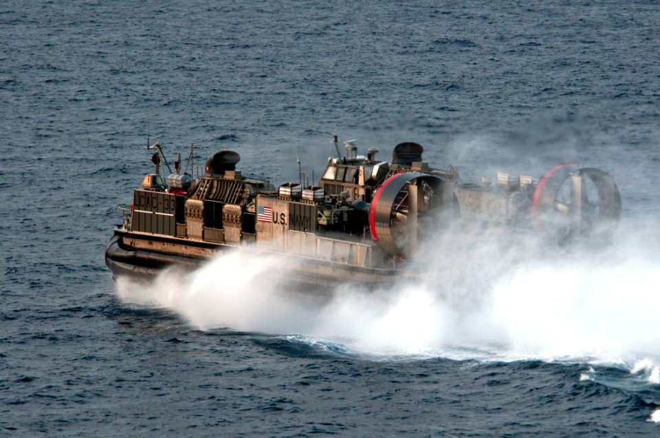 US Navy 110427-N-RC734-220 A landing craft air cushion (LCAC) assigned to Assault Craft Unit (ACU) 5 departs amphibious dock landing ship USS Comst