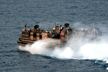 US Navy 110427-N-RC734-220 A landing craft air cushion (LCAC) assigned to Assault Craft Unit (ACU) 5 departs amphibious dock landing ship USS Comst