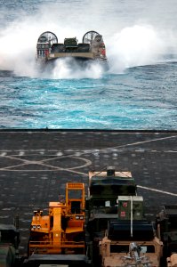 US Navy 110427-N-RC734-354 A landing craft air cushion (LCAC) assigned to Assault Craft Unit (ACU) 5 approaches the amphibious dock landing ship US photo