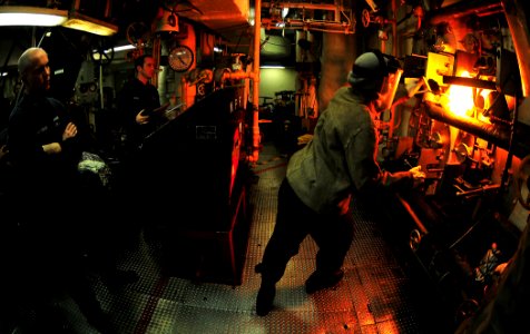 US Navy 110430-N-ZS026-091 Machinist's Mate 3rd Class Brittany Kujawski prepares to insert the