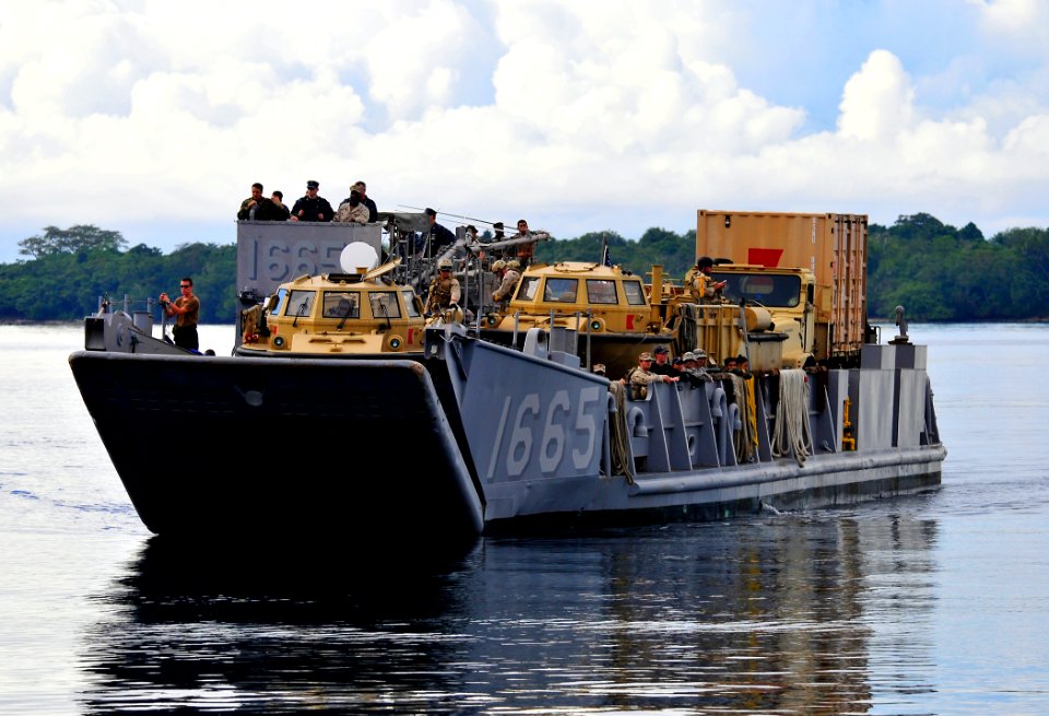 US Navy 110428-N-KB563-032 Landing Craft Utility (LCU) 1665 approaches the beach in Espiritu Santo during Pacific Partnership 2011