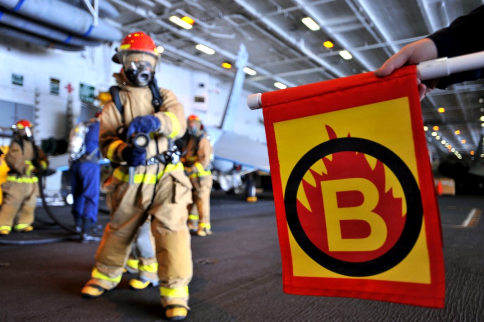 US Navy 110429-N-0569K-007 A hose team combats a simulated class bravo fire during a general quarters drill aboard USS Enterprise (CVN 65)