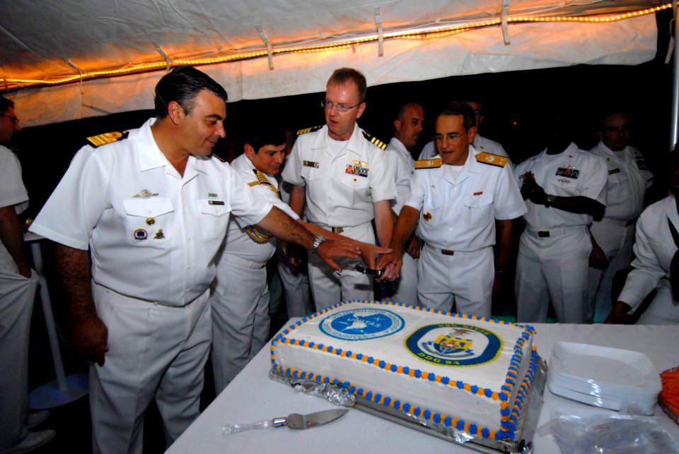 US Navy 110429-N-ZI300-113 UNITAS 52 Atlantic Phase Task Group commanders cut a ceremonial cake at the U.S. reception aboard USS Nitze (DDG 94)