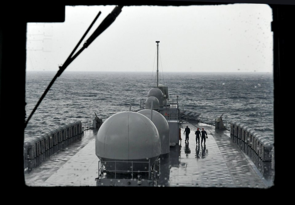 US Navy 110505-N-CP762-165 Damage control training team members conduct a safety walkthrough on the main deck of the U.S. 7th Fleet command ship US