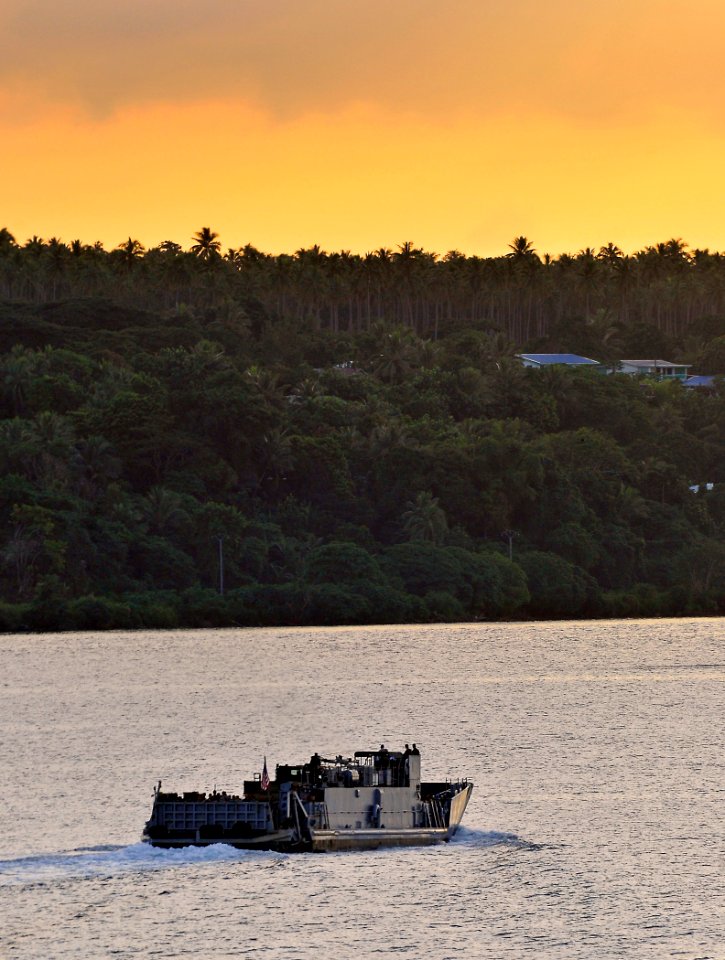US Navy 110508-N-KB563-002 Service members and nongovernmental organization personnel ride in Landing Craft Utility (LCU) 1665 while en route to sh