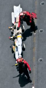 US Navy 110509-N-0074G-042 Sailors assigned to the aircraft carrier USS Enterprise (CVN 65) move ordnance off the flight deck