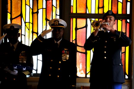 US Navy 110506-N-WW409-079 Spc. Jose Machuca plays Taps during the funeral service for Cryptologic Technician (Technical) 2nd Class Ryan Marks.