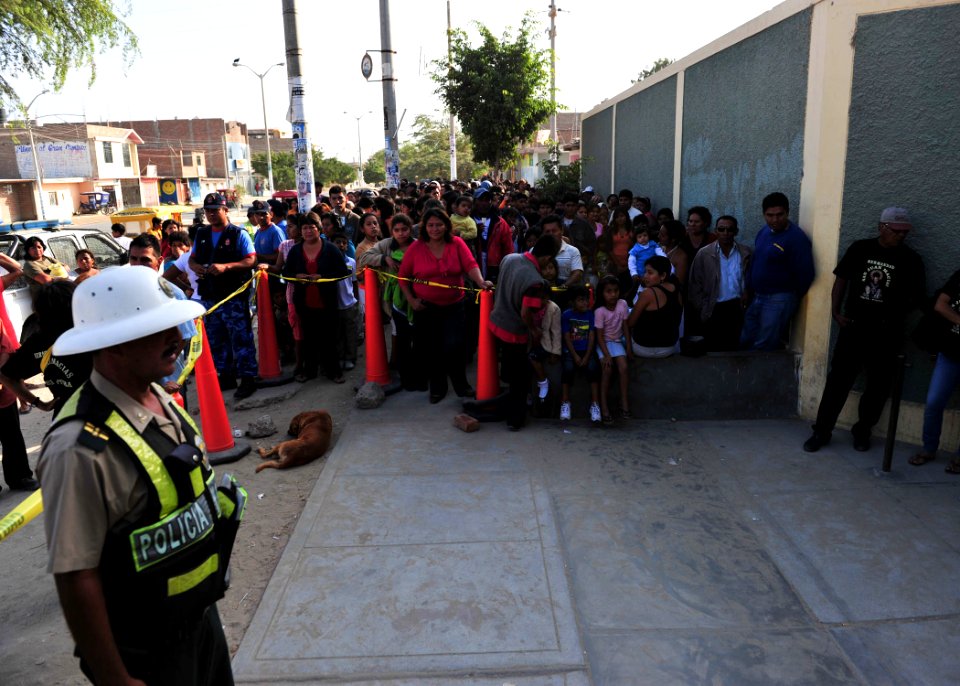 US Navy 110503-N-QD416-017 Patients wait outside the Sagrado Corazon de Jesus school for the opening of a Continuing Promise 2011 medical clinic
