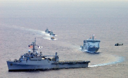US Navy 110509-N-KB563-512 The amphibious transport dock ship USS Cleveland (LPD 7) leads a formation of ships