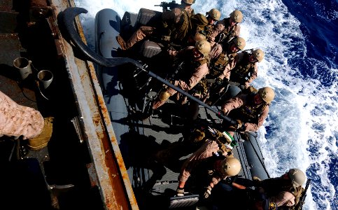 US Navy 110505-N-OS574-464 Marines prepare to hook a rigid-hull inflatable boat during a visit, board, search and seizure, hook and pull exercise