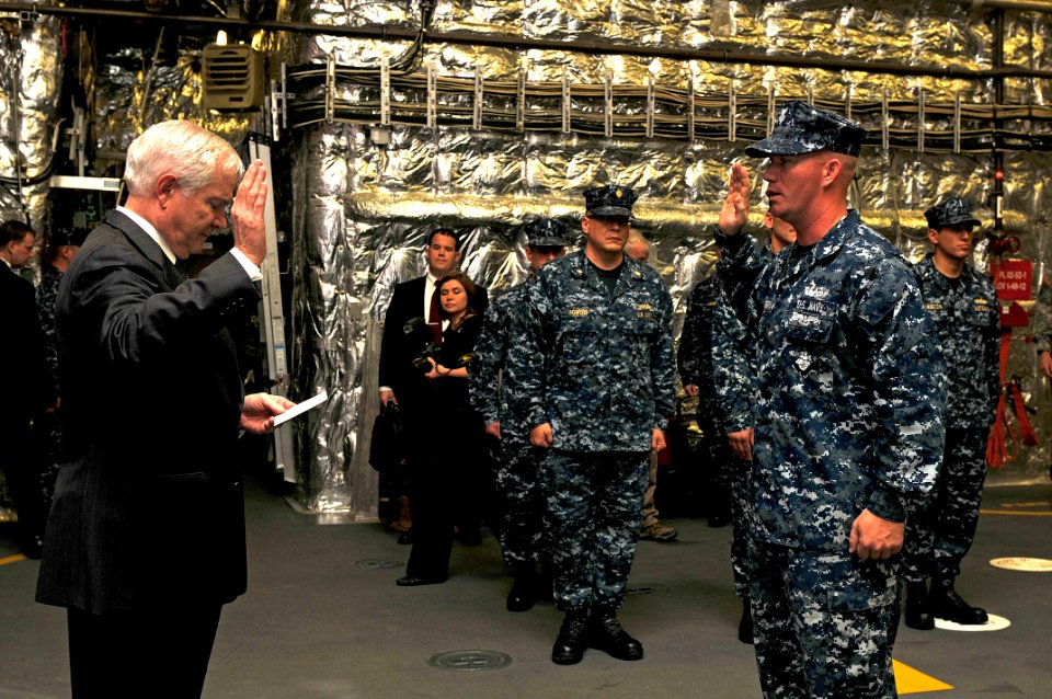 US Navy 110506-N-YR391-001 Secretary of Defense Robert M. Gates delivers the oath of enlistment to Boatswain's Mate 1st Class Nathan Ellsworth duri