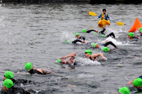 US Navy 110507-N-5891C-187 Sailors and other members of the Yokosuka community start the 400-meter swim portion of the 2011 Subway Triathlon Series