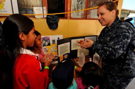 US Navy 110504-N-EP471-455 Hospitalman Jamie Lee talks with Peruvian children about the importance of proper hygiene and hand washing during a Cont