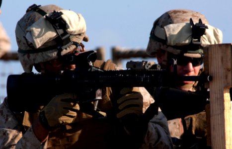 US Navy 110510-N-QP268-040 A Marine fires an M16 service rifle during a platoon live-fire weapons training aboard USS Whidbey Island (LSD 41)