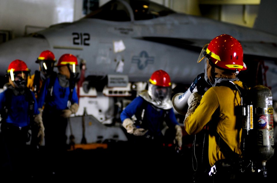 US Navy 110511-N-GZ277-132 Sailors participate in a mass casualty drill in the hangar bay of USS Carl Vinson (CVN 70)