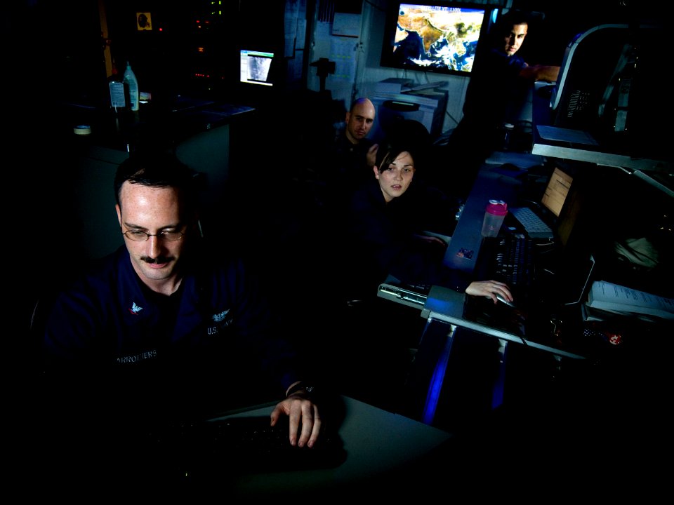 US Navy 110508-N-MD252-343 Sailors disseminate satellite weather data in the meteorological center aboard USS Carl Vinson (CVN 70)