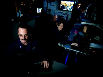 US Navy 110508-N-MD252-343 Sailors disseminate satellite weather data in the meteorological center aboard USS Carl Vinson (CVN 70)